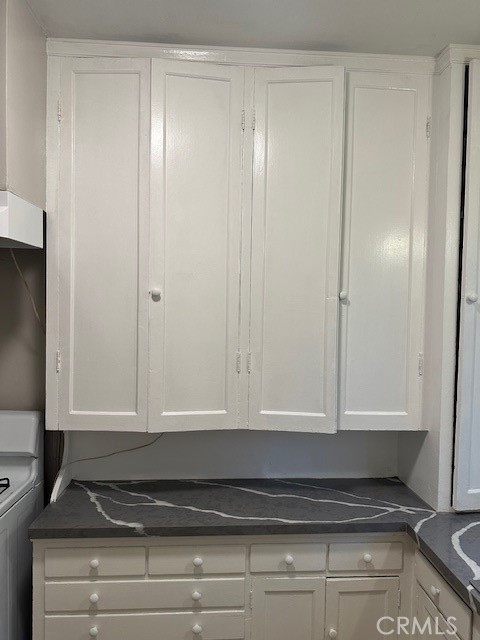 1025 Locust Avenue Long Beach, CA 90813 - Photo 46 of 64 a bathroom with a granite countertop sink and cabinets