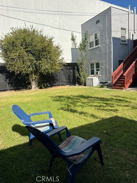 1025 Locust Avenue Long Beach, CA 90813 - Photo 59 of 64 a view of a chairs and table in backyard