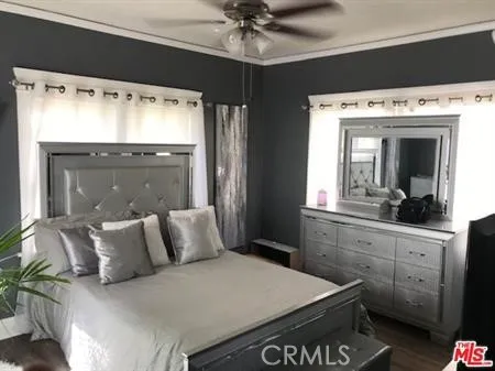 a bedroom with a large bed and a couch