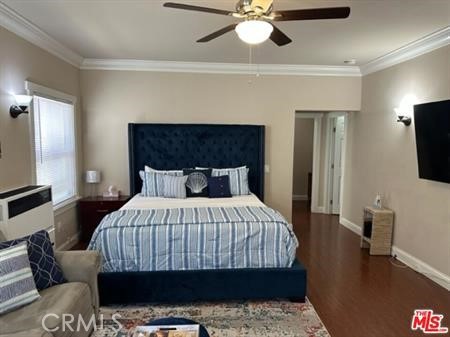 1025 Locust Avenue Long Beach, CA 90813 - Photo 10 of 64 a bedroom with a bed a flat screen tv and a couch