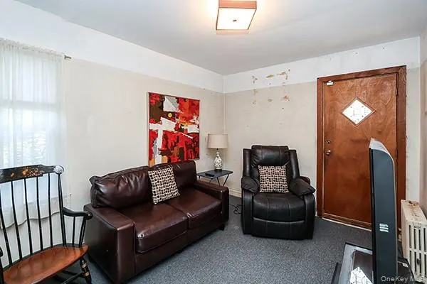 a bedroom with furniture and a wooden floor