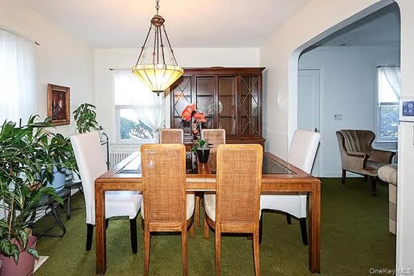 a dining room with furniture and window