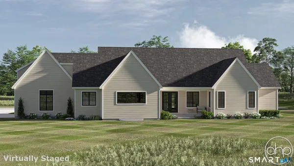 a front view of a house with a garden