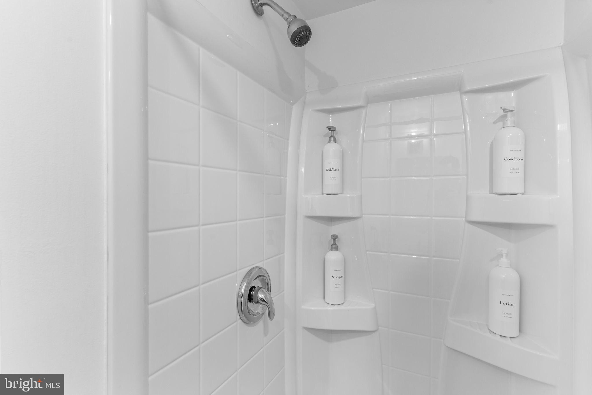 496 East King Road Malvern, PA 19355 - Photo 34 of 35 Sleek, modern shower with minimalist design.