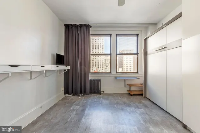 a view of an empty room with a window