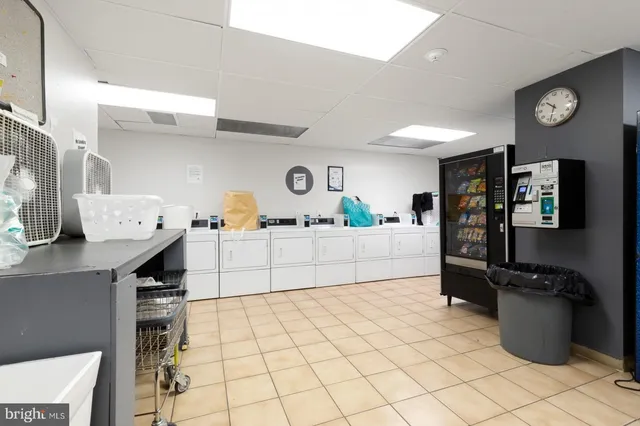 a kitchen with stainless steel appliances cabinets and a counter top space