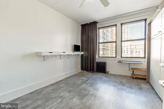 a view of an empty room with a window