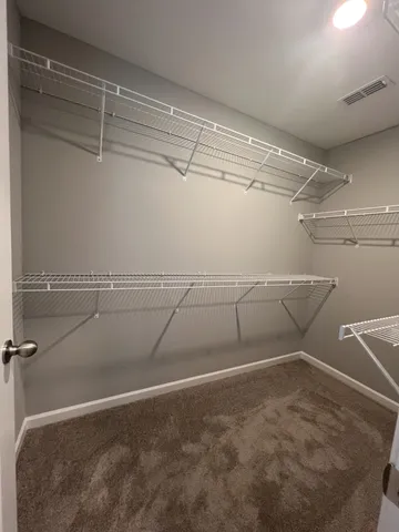 a view of a room with racks on the wall