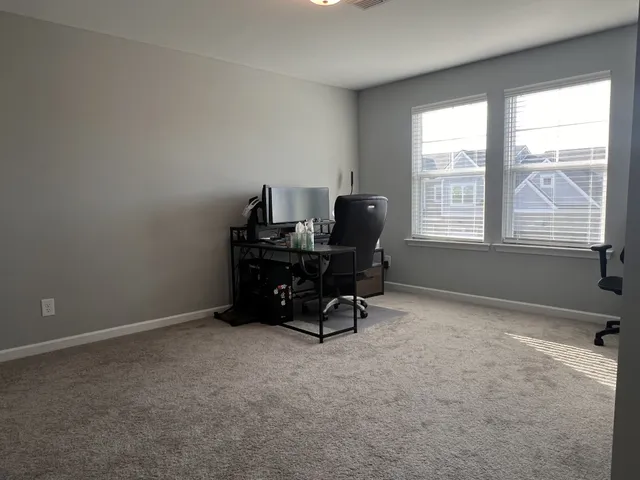 a workspace with furniture and a window