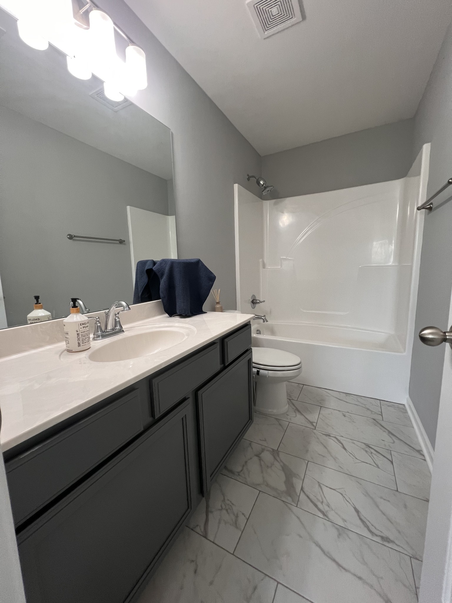 5727 Dockside Rockvale, TN 37153 - Photo 17 of 19 a bathroom with a double vanity sink a toilet and a mirror