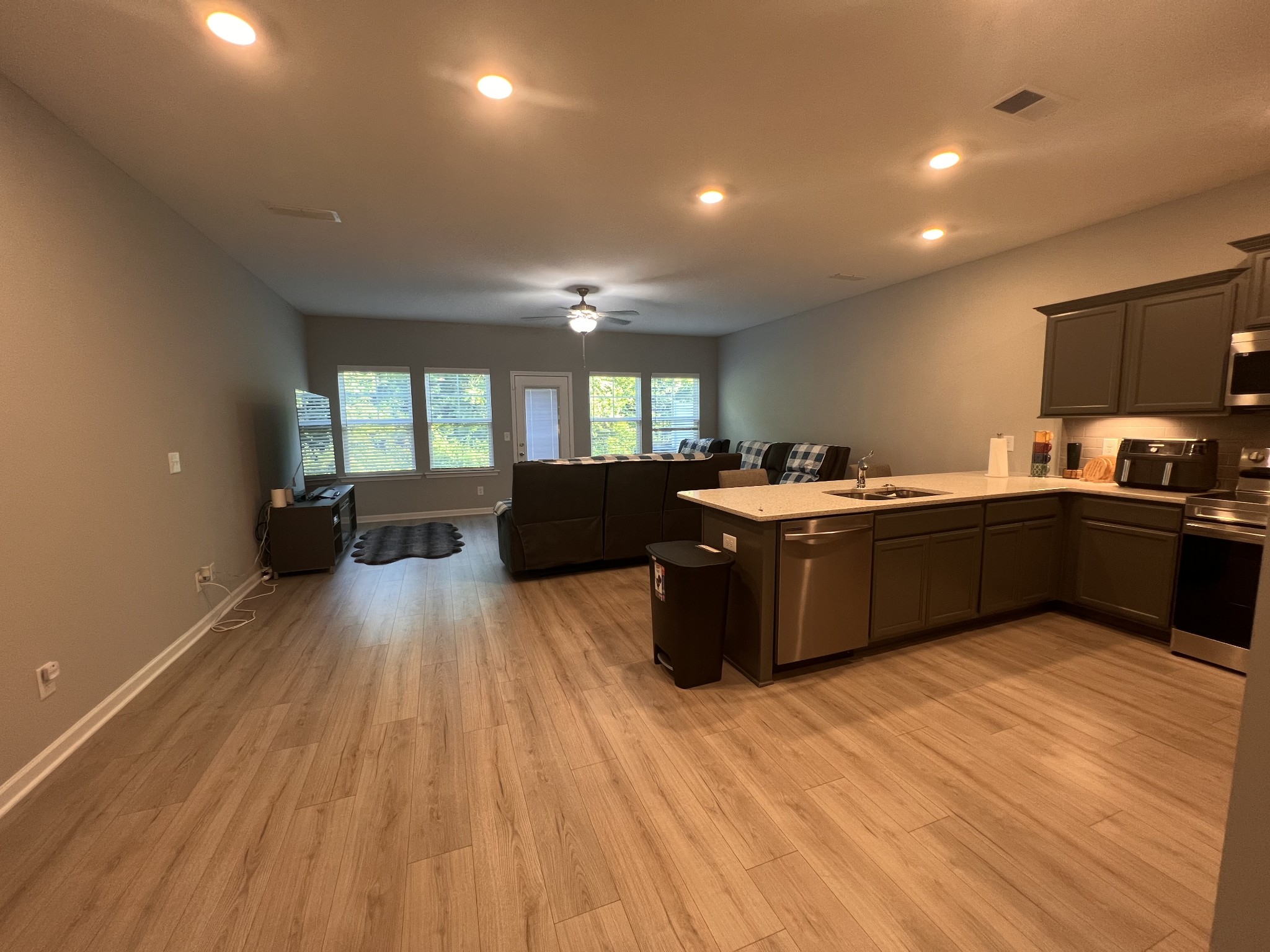 5727 Dockside Rockvale, TN 37153 - Photo 4 of 19 a kitchen with stainless steel appliances granite countertop a sink a stove and a wooden floors