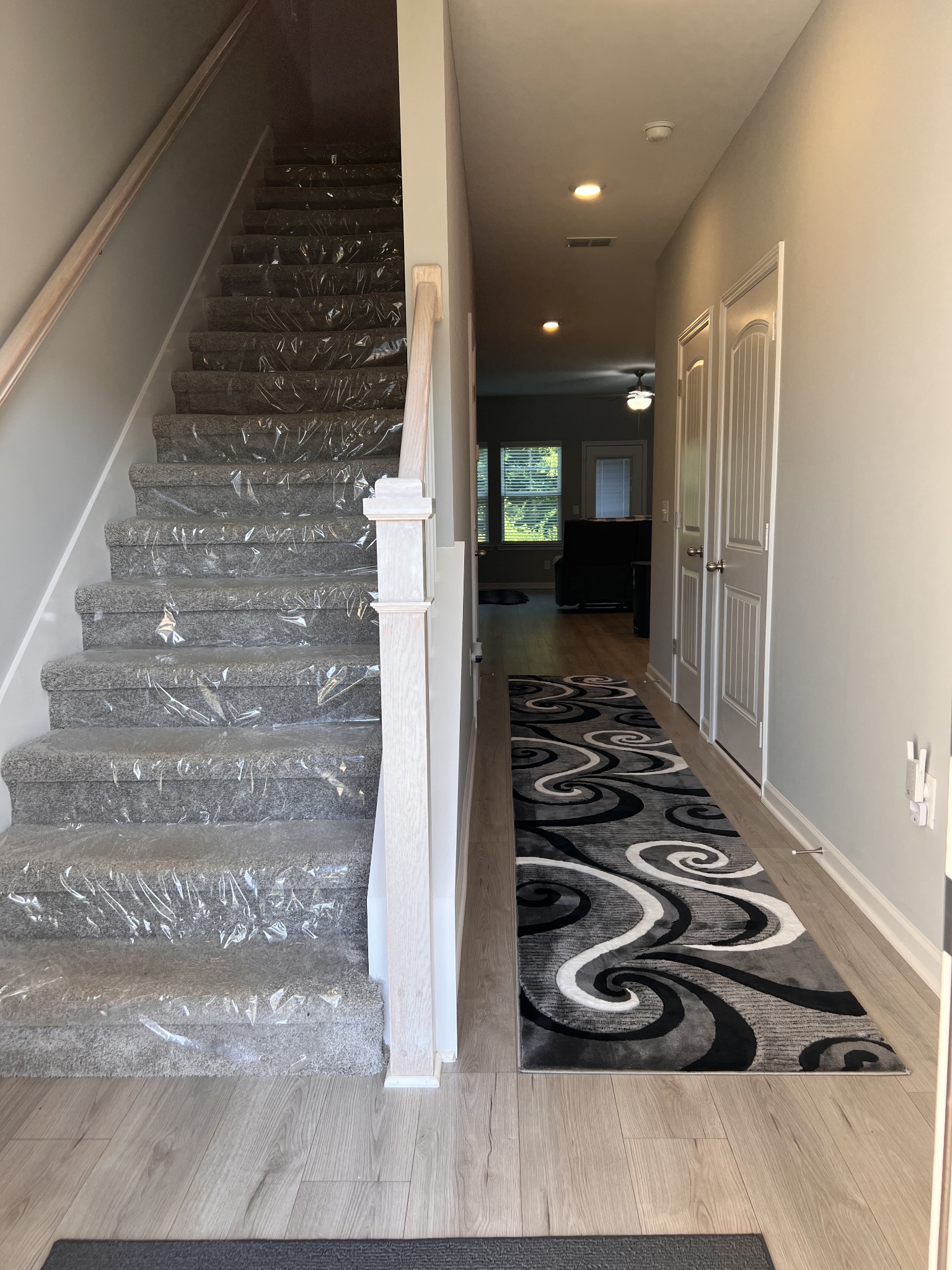 5727 Dockside Rockvale, TN 37153 - Photo 7 of 19 a view of a hallway with wooden floor and a bathroom