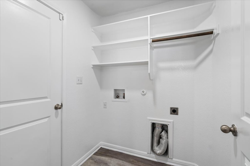19040 Kimberlite Drive Pflugerville, TX 78660 - Photo 18 of 40 Laundry area featuring gas dryer hookup, hookup for an electric dryer, dark wood-type flooring, and hookup for a washing machine