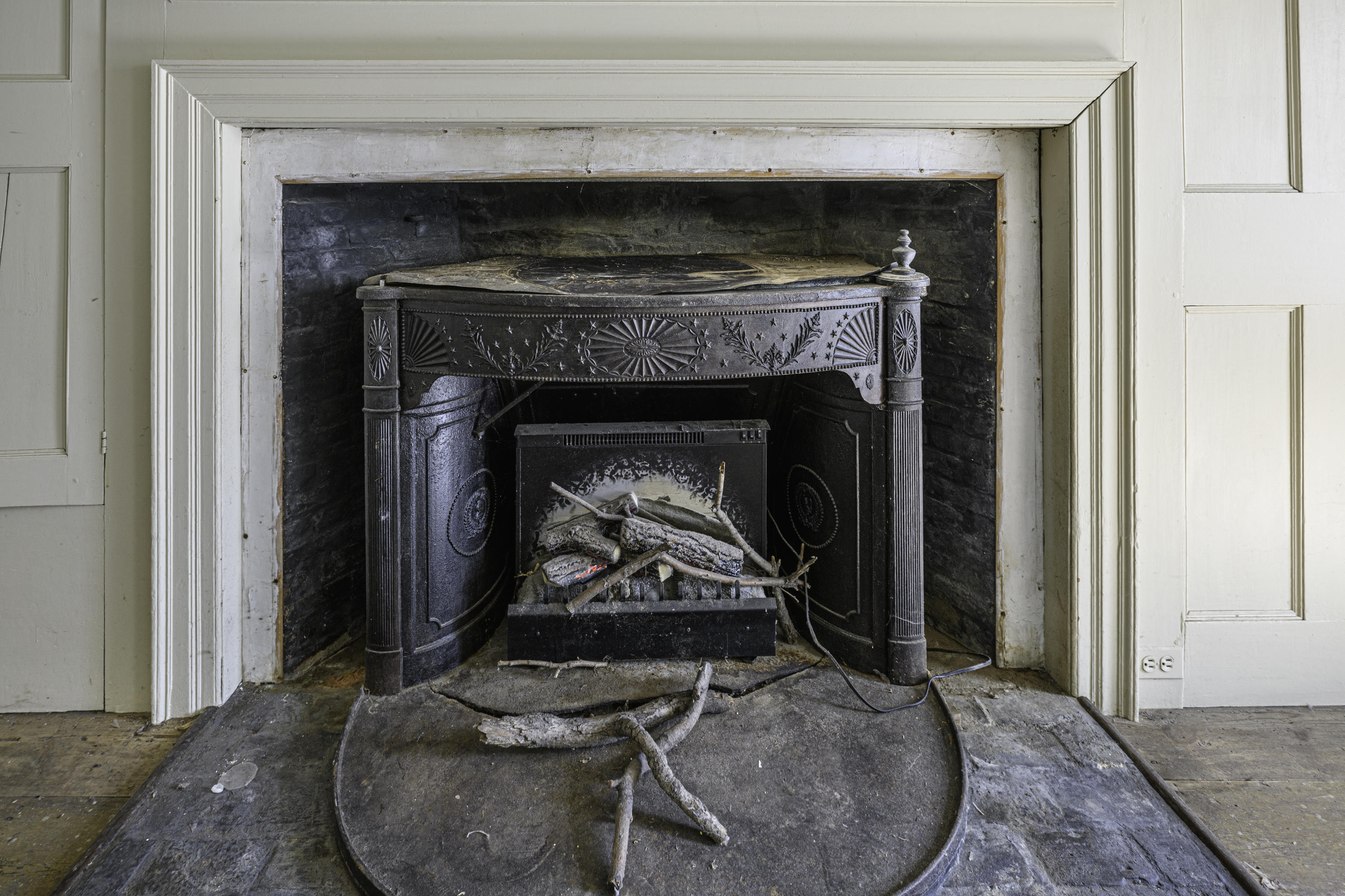 2591 Post Road Darien, CT 06820 - Photo 17 of 46 a living room with a fireplace and a wooden floor