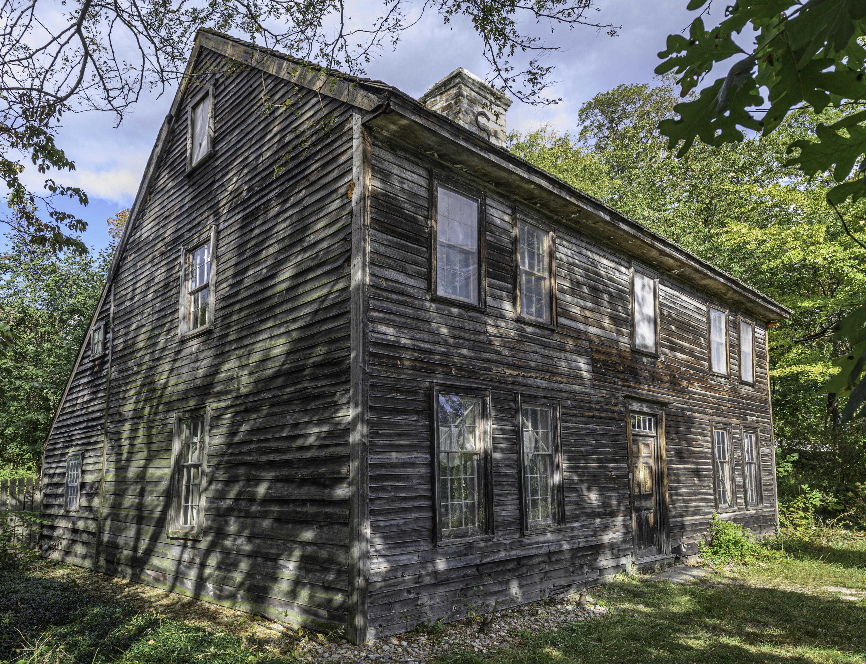 2591 Post Road Darien, CT 06820 - Photo 3 of 46 a front view of a house with a garden
