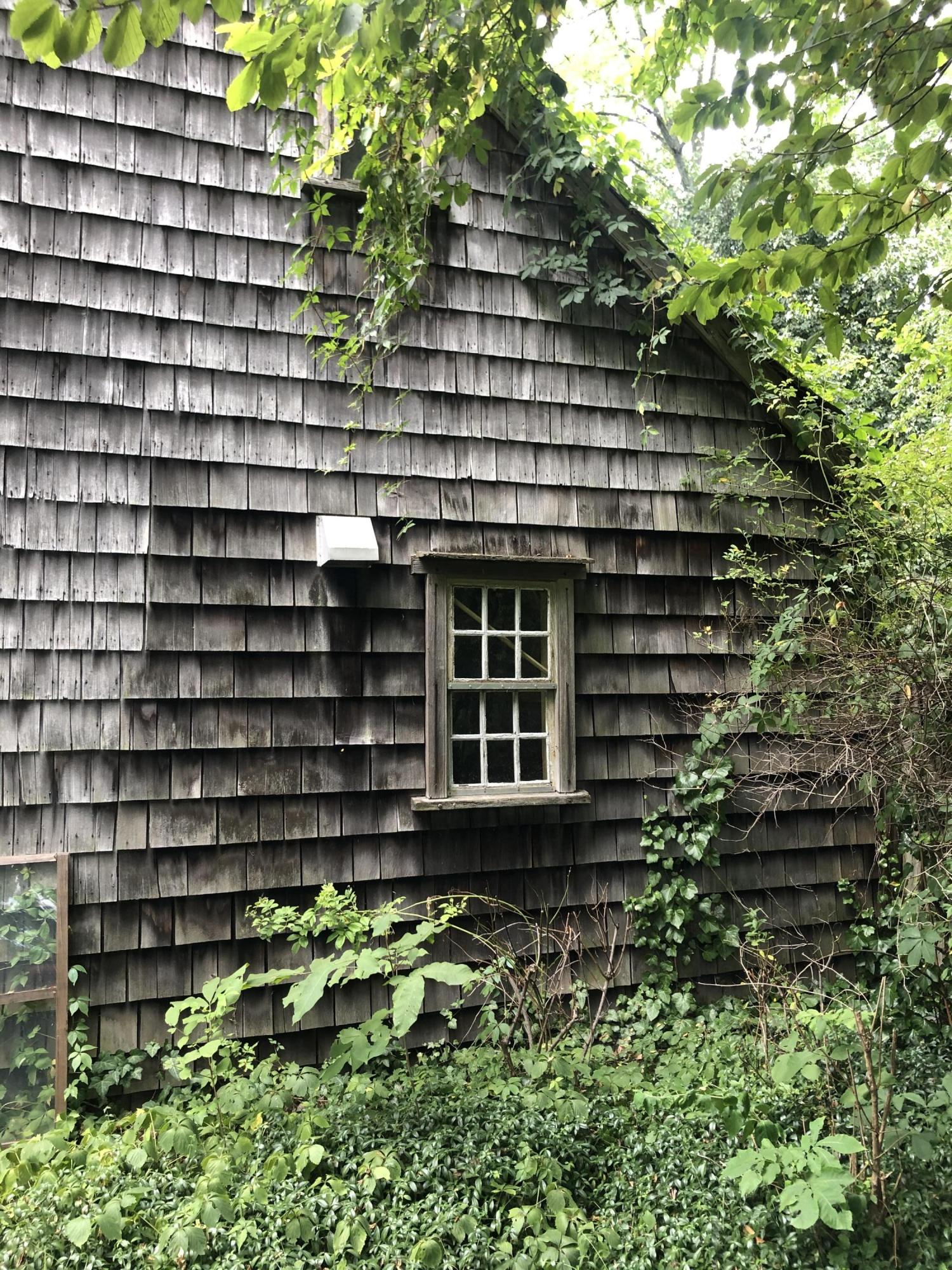 2591 Post Road Darien, CT 06820 - Photo 6 of 46 a front view of a house with a garden