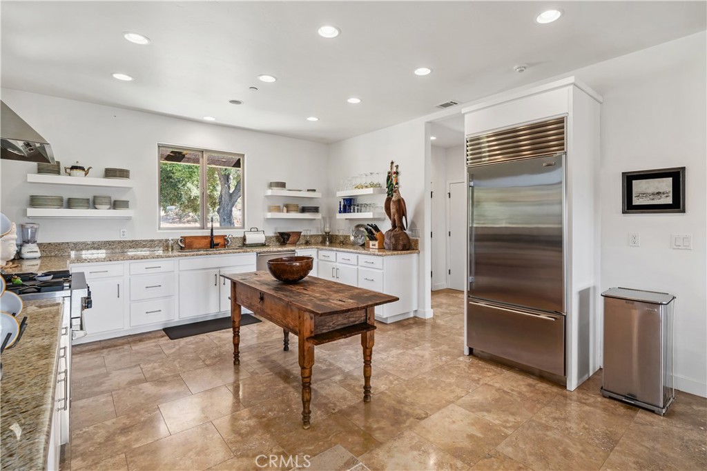 8680 Alamo Creek Road Santa Maria, CA 93454 - Photo 16 of 74 a kitchen with a refrigerator and a sink