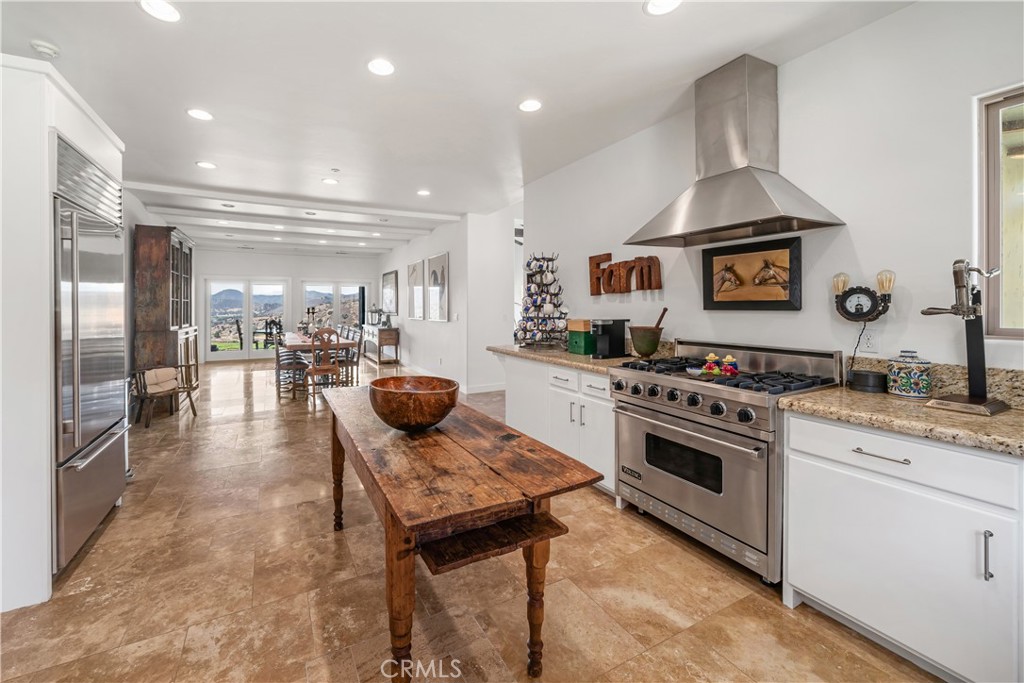 8680 Alamo Creek Road Santa Maria, CA 93454 - Photo 18 of 74 a kitchen with a stove and a refrigerator
