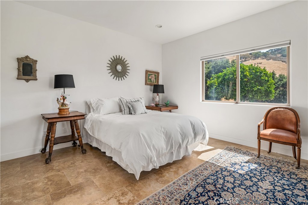 8680 Alamo Creek Road Santa Maria, CA 93454 - Photo 28 of 74 a bedroom with a bed and a chair