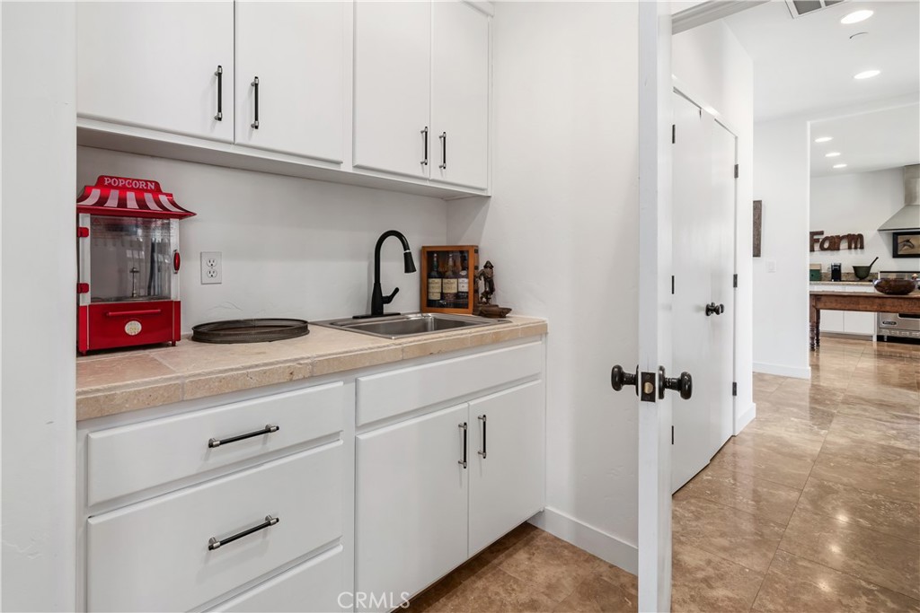 8680 Alamo Creek Road Santa Maria, CA 93454 - Photo 30 of 74 a kitchen with cabinets and appliances