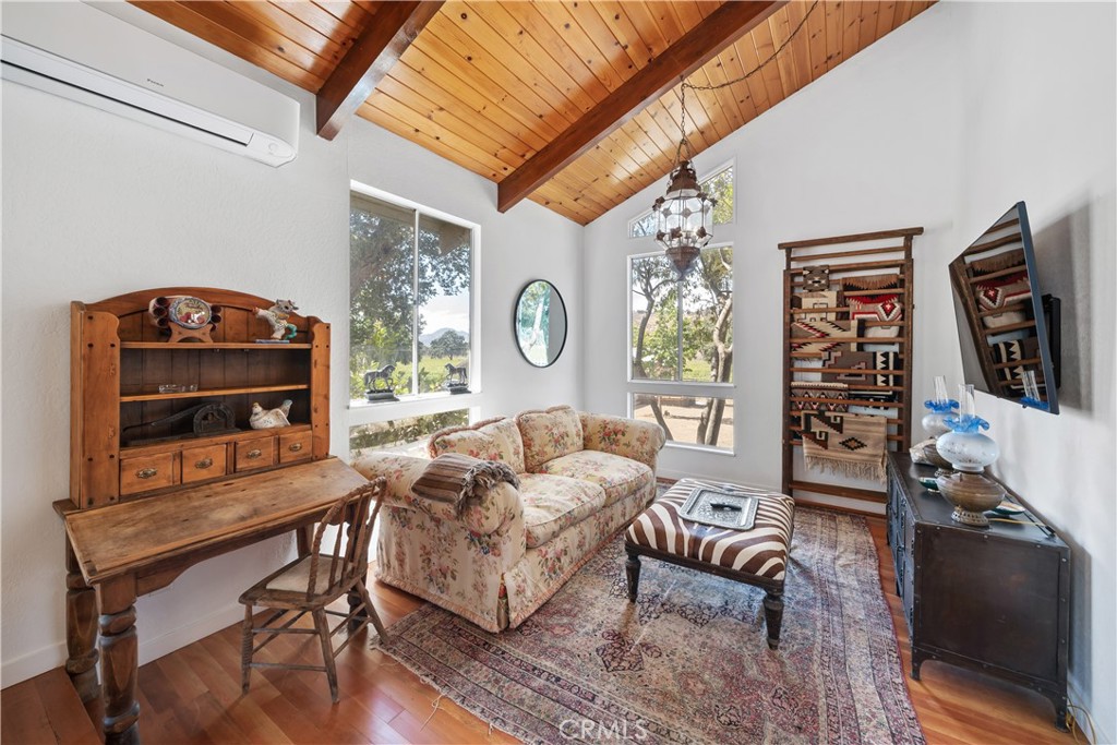 8680 Alamo Creek Road Santa Maria, CA 93454 - Photo 61 of 74 a living room with furniture a window and a flat screen tv