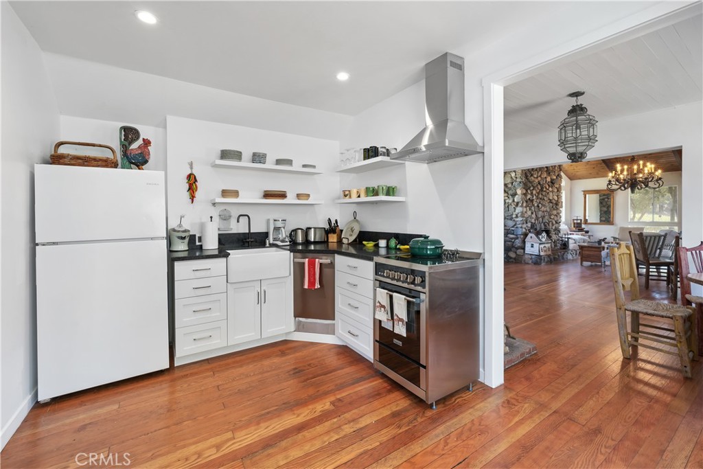 8680 Alamo Creek Road Santa Maria, CA 93454 - Photo 64 of 74 a kitchen with granite countertop a refrigerator stove top oven and cabinets