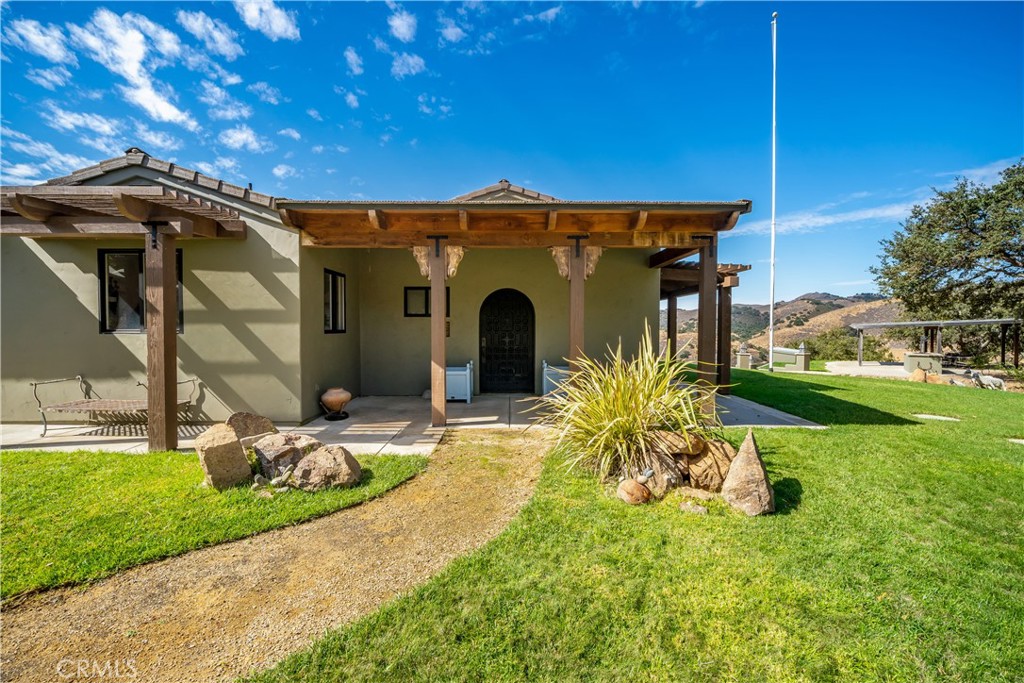 8680 Alamo Creek Road Santa Maria, CA 93454 - Photo 7 of 74 a front view of a house with garden