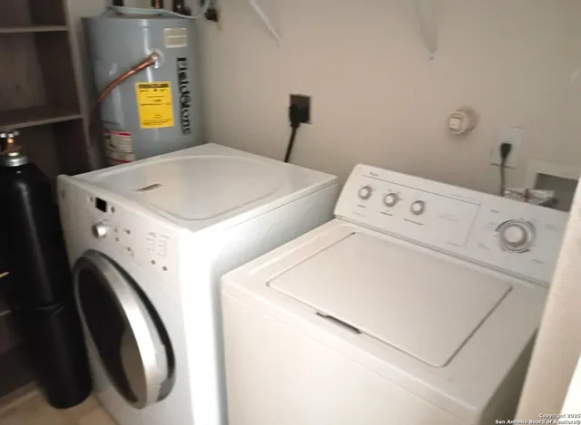 a utility room with dryer and washer