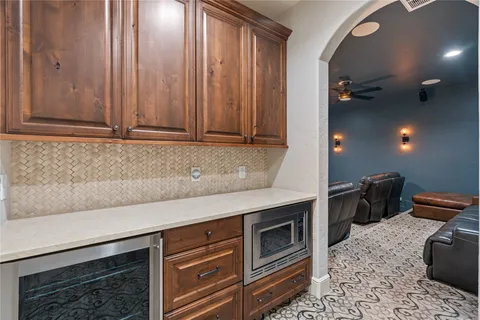 a kitchen with a sink cabinets and appliances