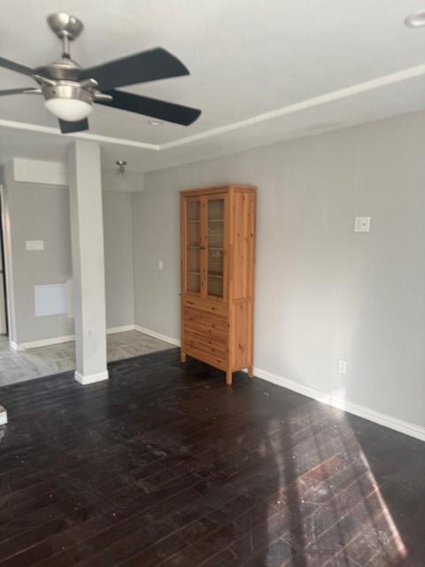 2400 Jupiter Road, Unit F1 Plano, TX 75074 - Photo 4 of 9 a view of an empty room with wooden floor and a ceiling fan