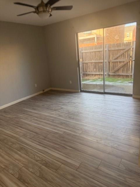 2400 Jupiter Road, Unit F1 Plano, TX 75074 - Photo 5 of 9 wooden floor in an empty room with a window