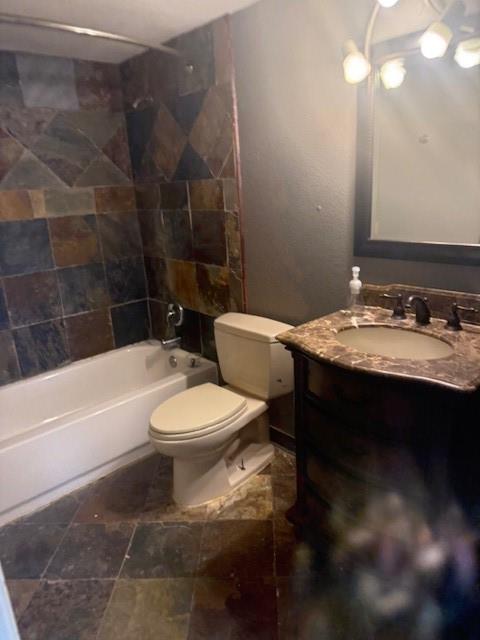 2400 Jupiter Road, Unit F1 Plano, TX 75074 - Photo 6 of 9 a bathroom with a sink a toilet and bathtub