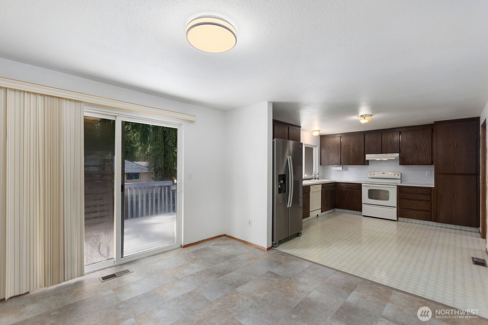 21627 9th Place West Bothell, WA 98021 - Photo 12 of 40 a view of kitchen with stainless steel appliances kitchen island large windows and cabinets