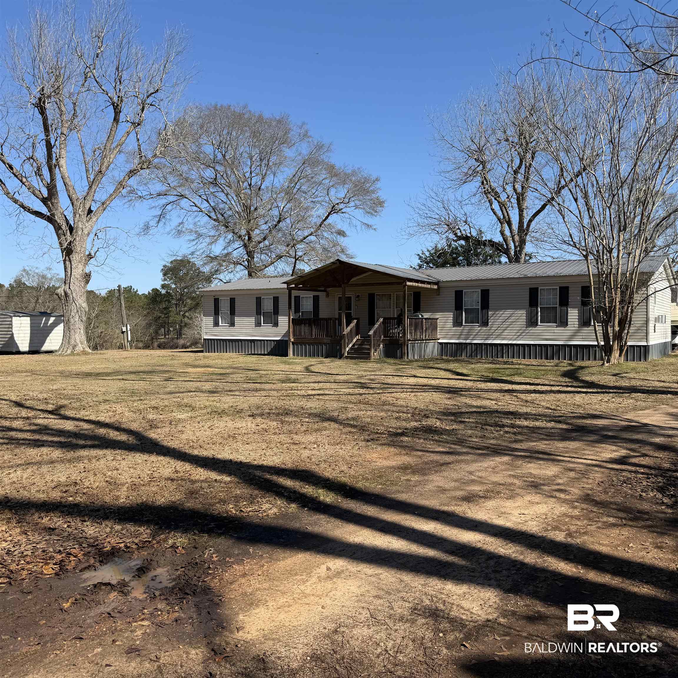 447 Sugar Hill Road Monroeville, AL 36460 - Photo 1 of 27 Manufactured / mobile home featuring a front yard and a wooden deck