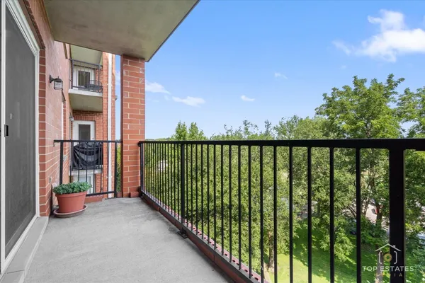 a view of a balcony with an outdoor space