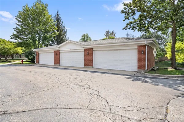a white house with trees in front of it