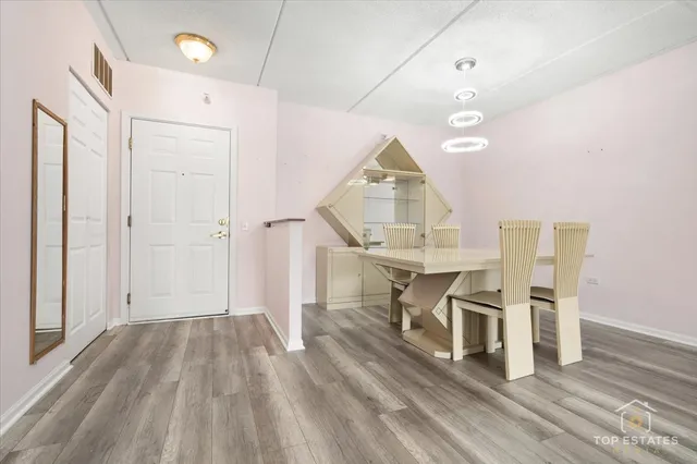 a view of kitchen with furniture and wooden floor
