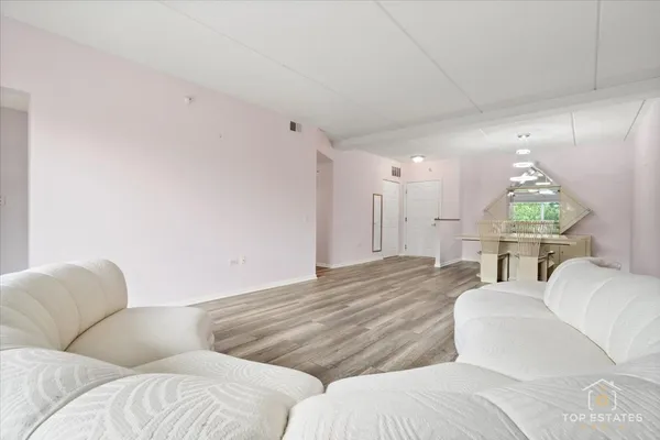 a living room with couches and a couch