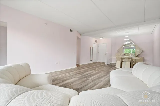 a living room with couches and a couch