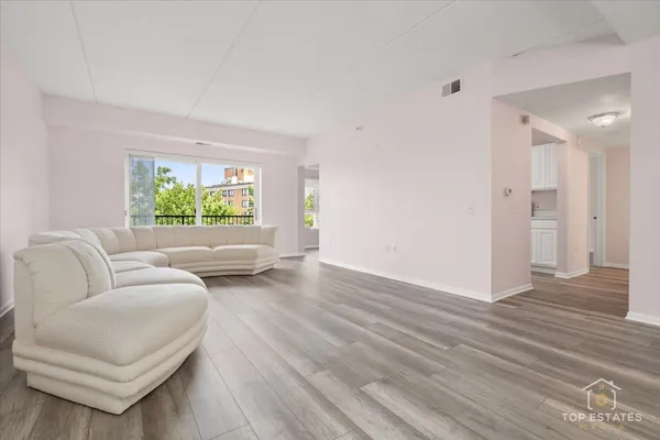 a living room with furniture and a window
