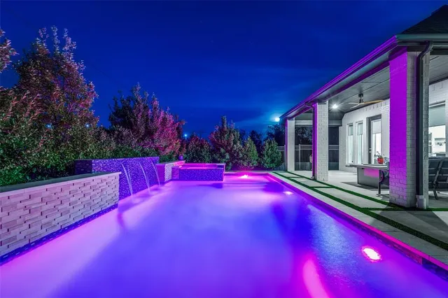 a view of swimming pool with an outdoor space and seating area