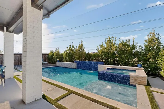 a view of backyard with trampoline