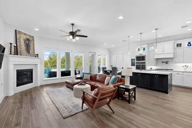 a living room with furniture fireplace and window