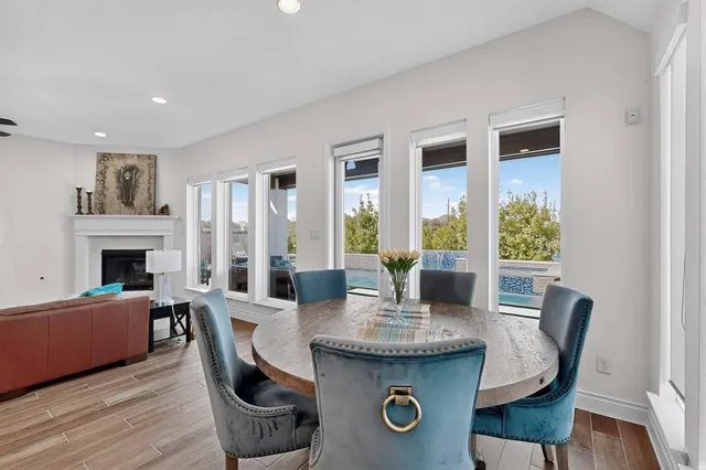 a view of a dining room with furniture window and wooden floor