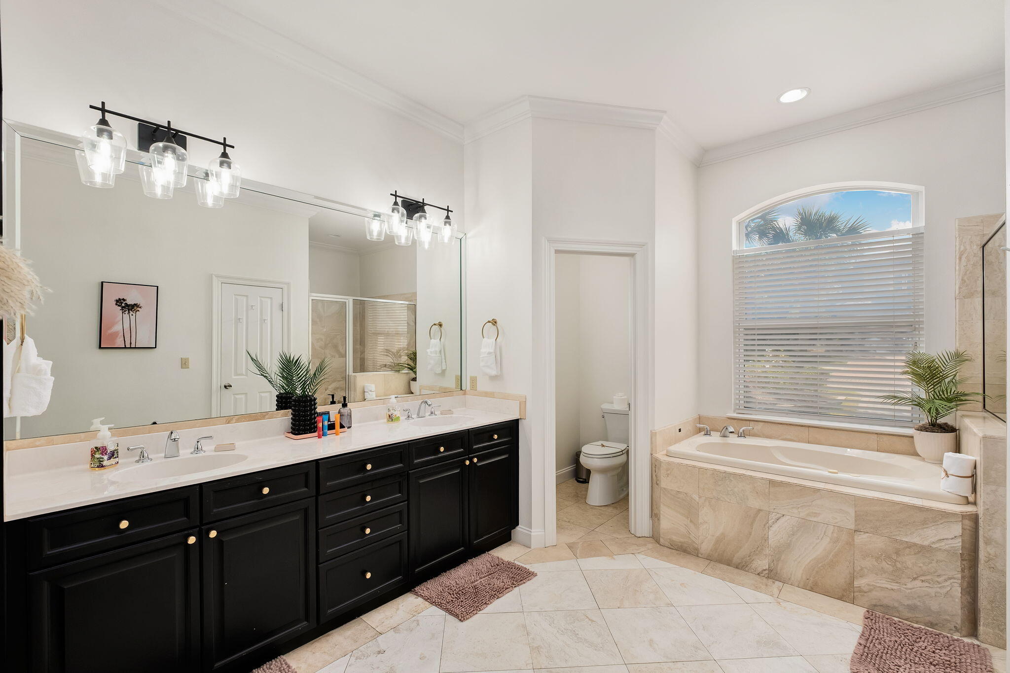 35 Tranquility Lane Destin, FL 32541 - Photo 11 of 19 a spacious bathroom with a double vanity sink a large mirror and a bathtub