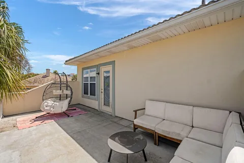 a view of a chairs and table in the patio