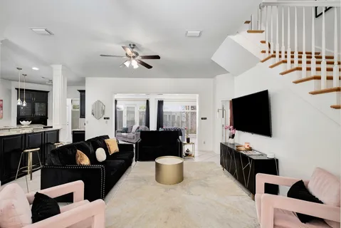 a kitchen with stainless steel appliances kitchen island granite countertop a sink stove and refrigerator