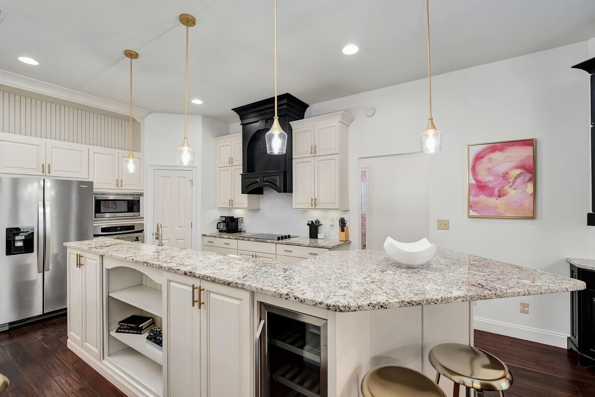 35 Tranquility Lane Destin, FL 32541 - Photo 8 of 19 a kitchen with granite countertop kitchen island stainless steel appliances a sink stove refrigerator and wooden floor