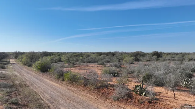 a view of a road with mountains in the background