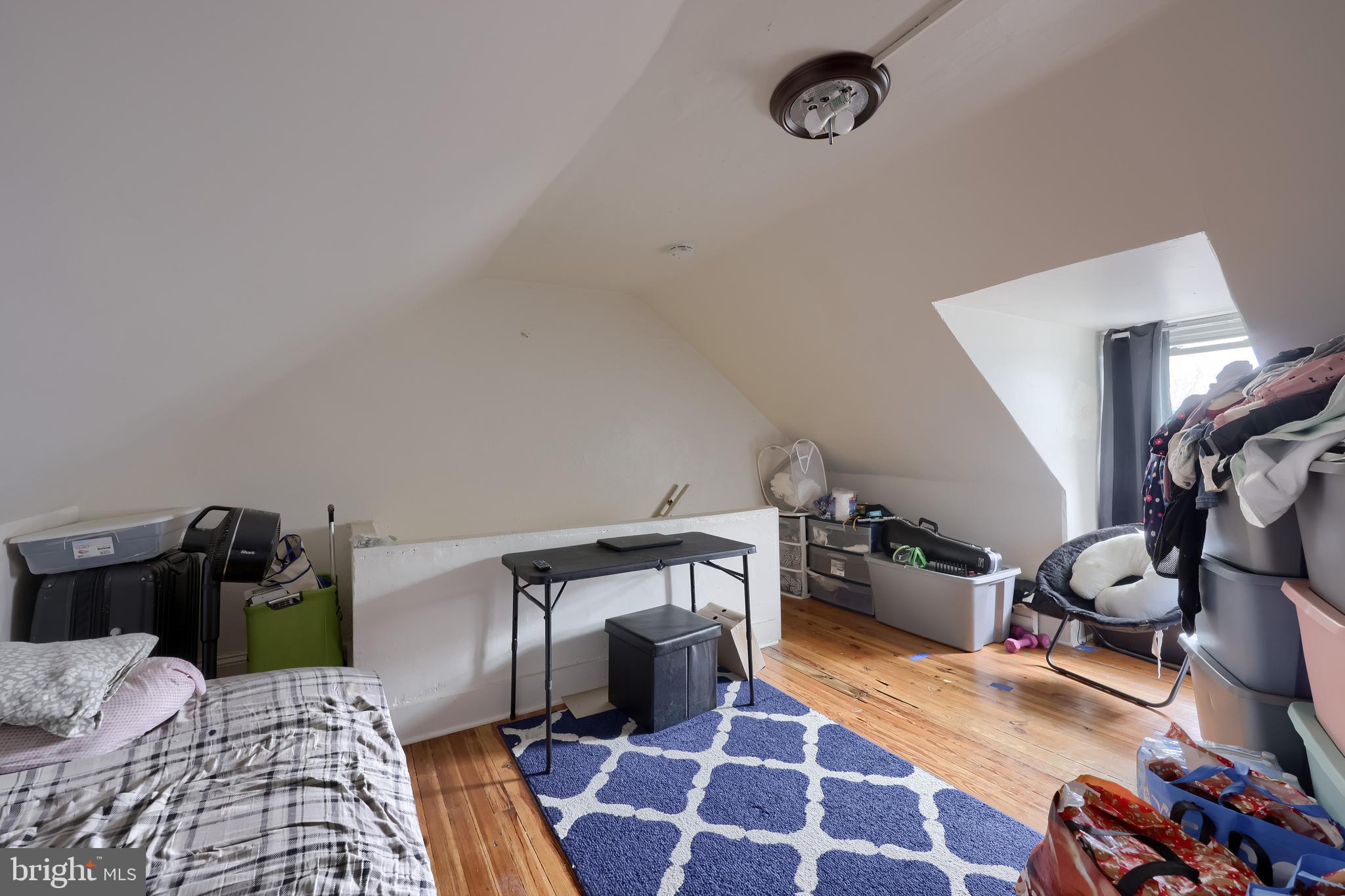 670 Hebrank Street Lancaster, PA 17603 - Photo 18 of 22 a bedroom with a bed and wooden floor